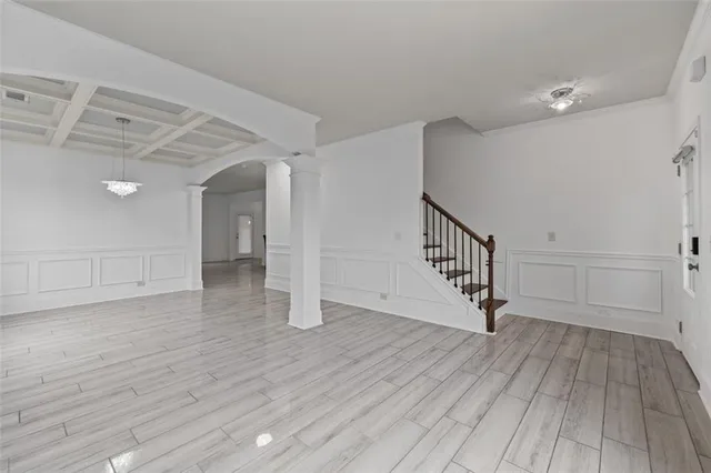 a view of an entryway with wooden floor
