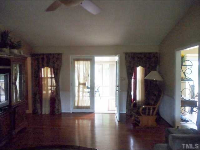 100 Harris Road Smithfield, NC 27577 - Photo 6 of 22 Living Room leads to year round Sun Room