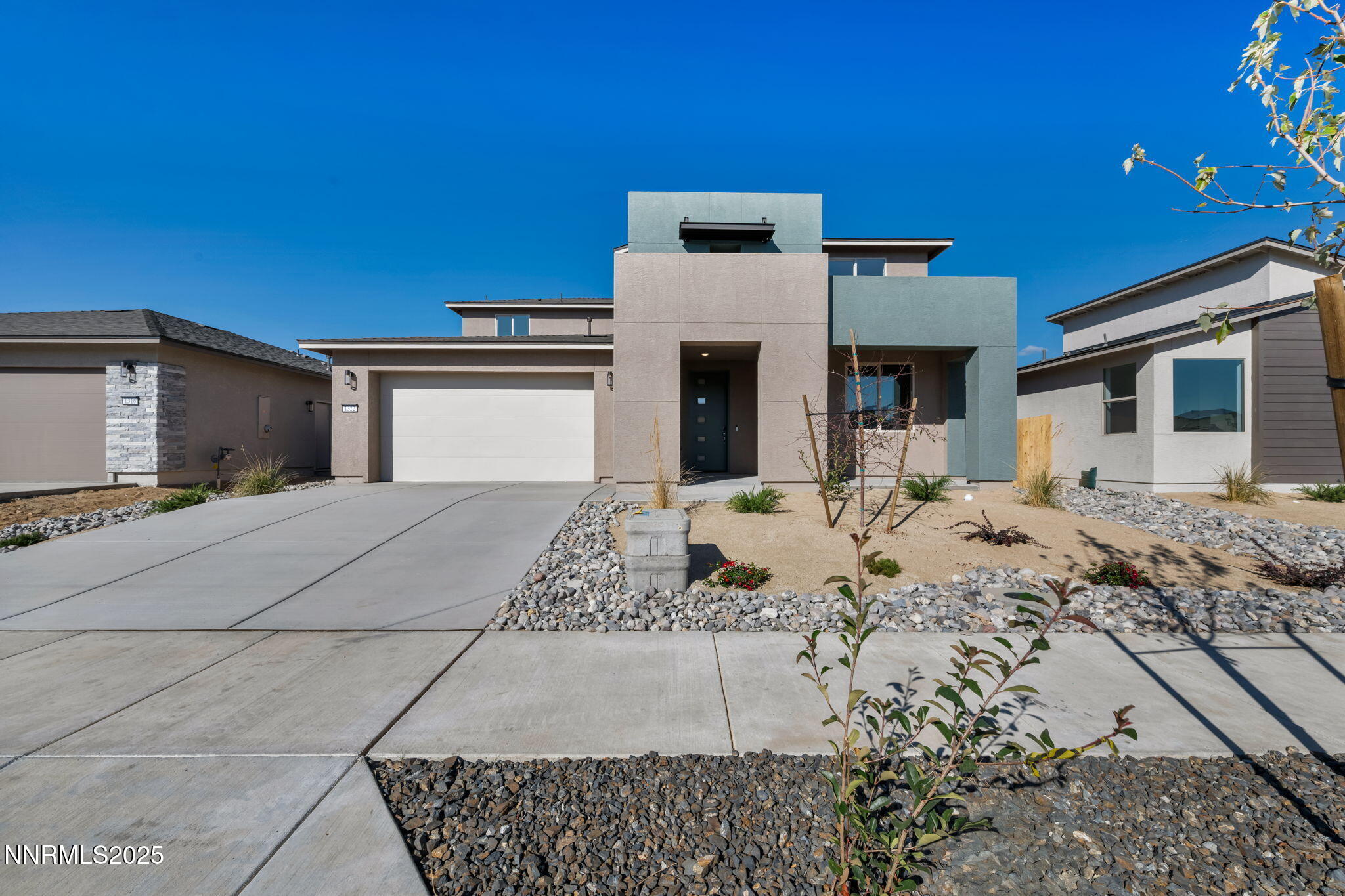 1322 Nebula Road, Unit HOMESITE 92 Carson City, NV 89705 - Photo 1 of 22 a front view of a house with a yard