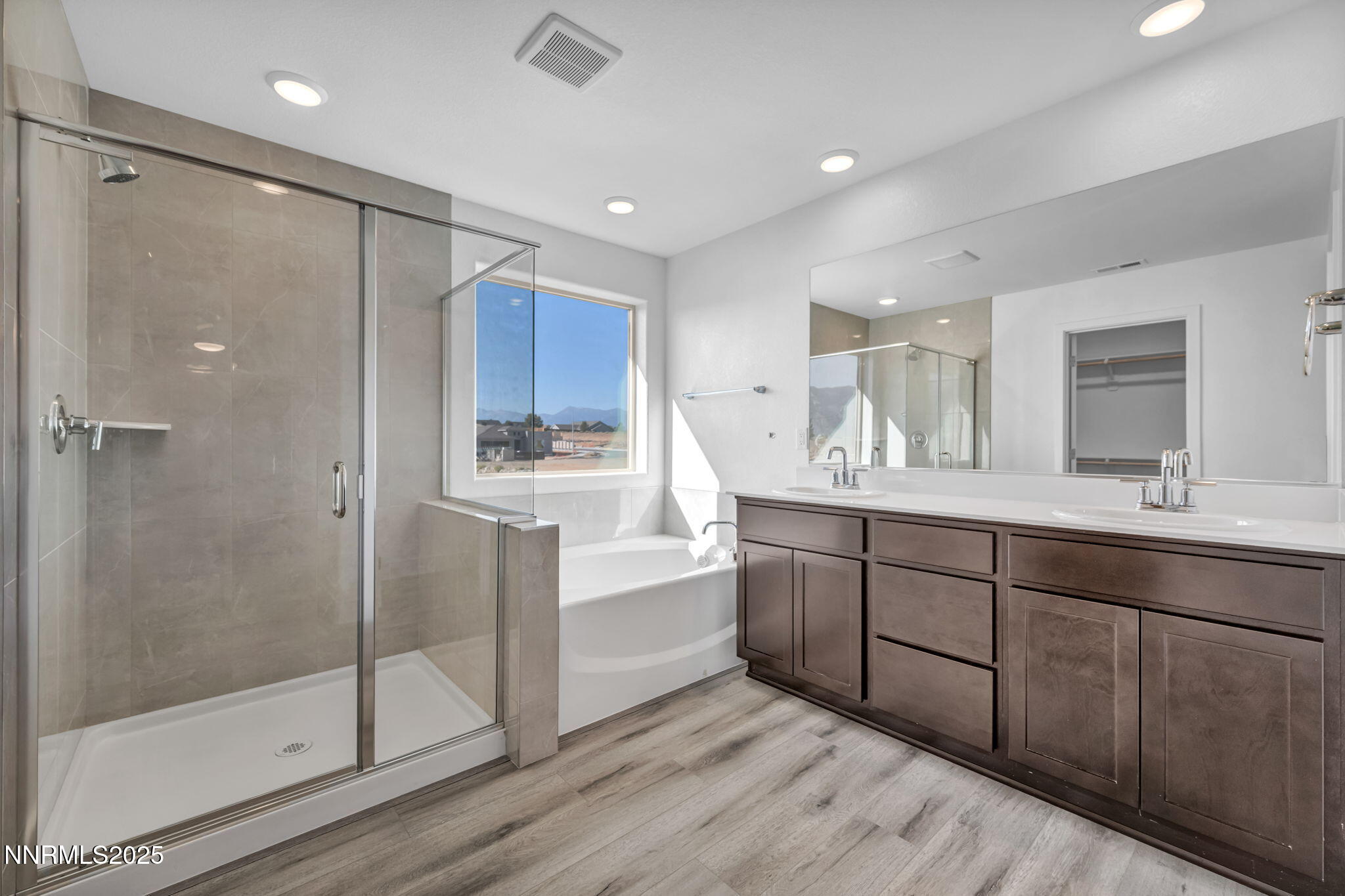 1322 Nebula Road, Unit HOMESITE 92 Carson City, NV 89705 - Photo 13 of 22 a spacious bathroom with a shower sink and mirror