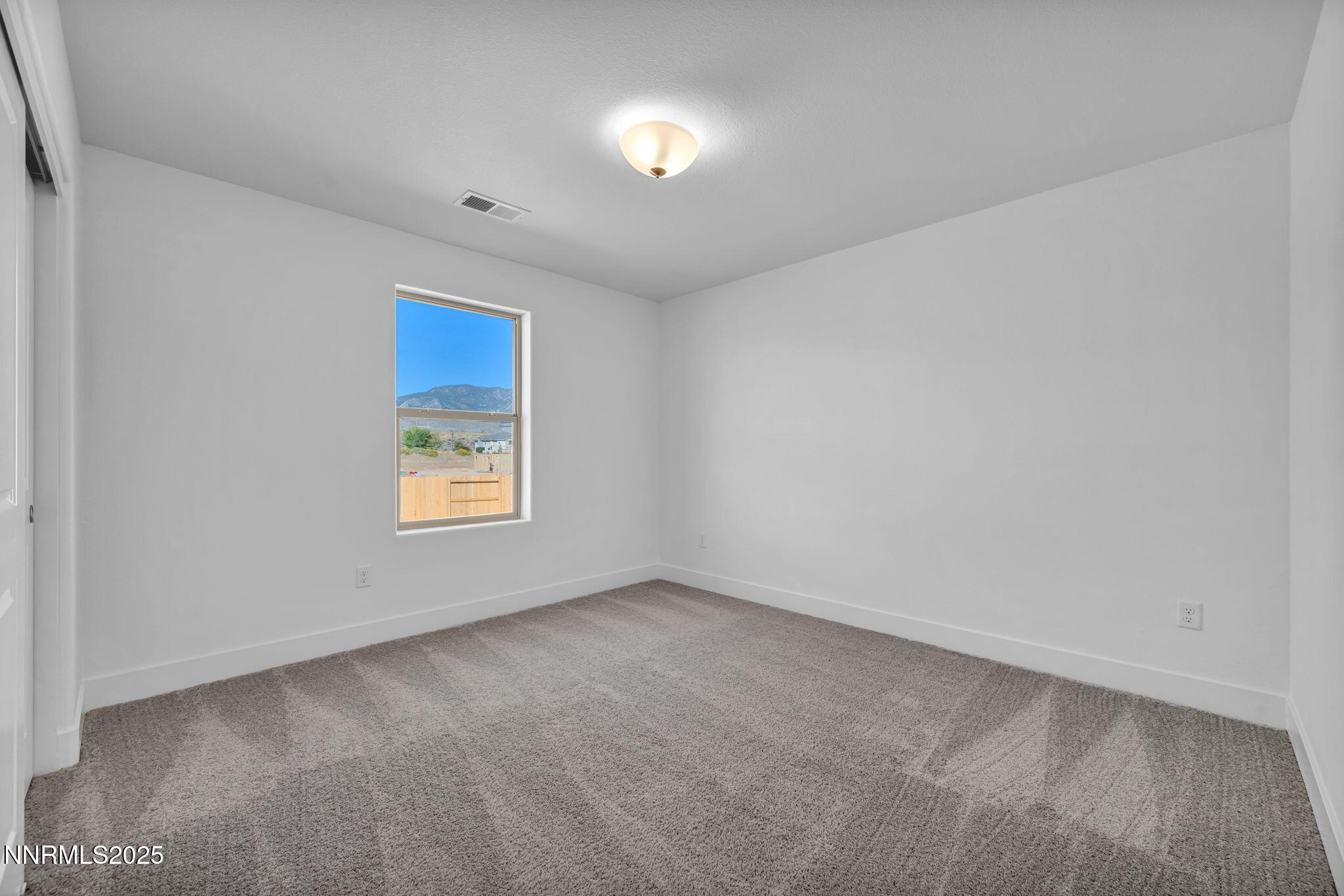 1322 Nebula Road, Unit HOMESITE 92 Carson City, NV 89705 - Photo 17 of 22 an empty room with a window