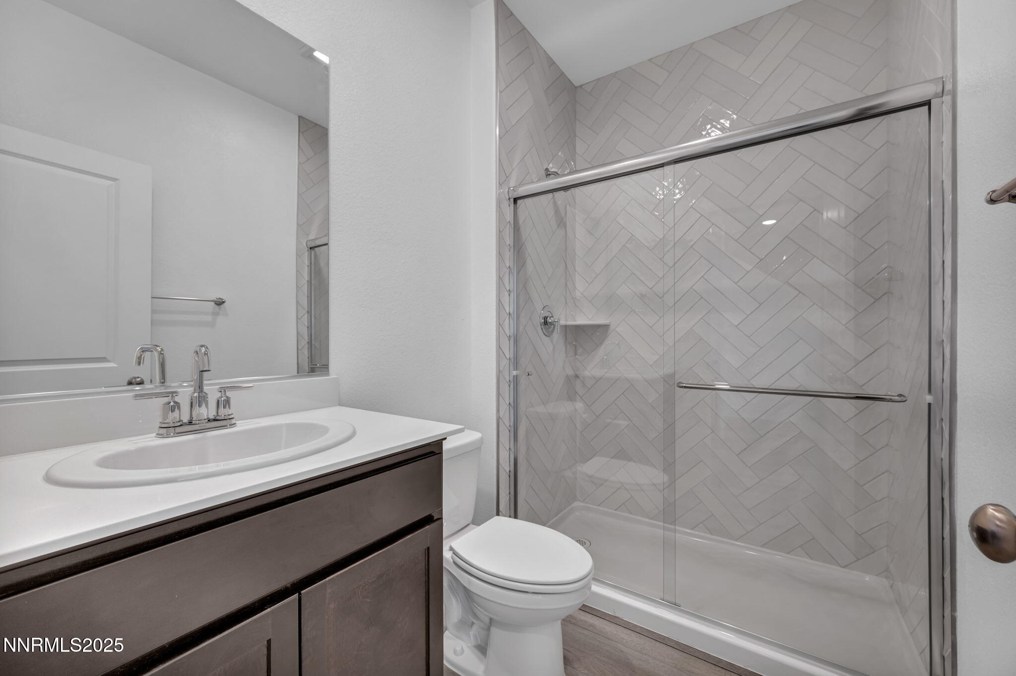 1322 Nebula Road, Unit HOMESITE 92 Carson City, NV 89705 - Photo 19 of 22 a bathroom with a sink toilet and shower
