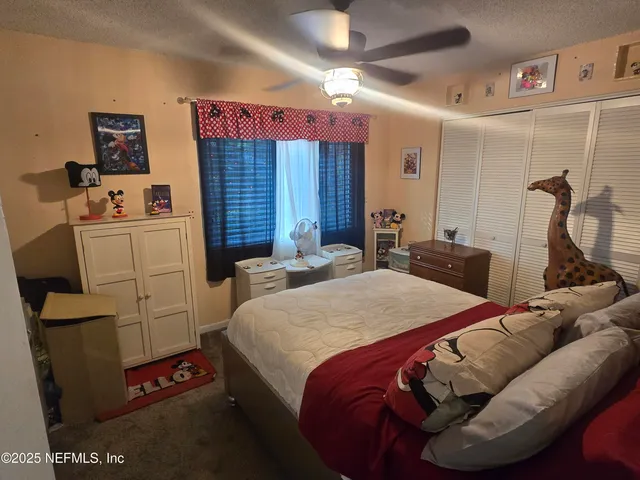 a bed room with a bed and a couch