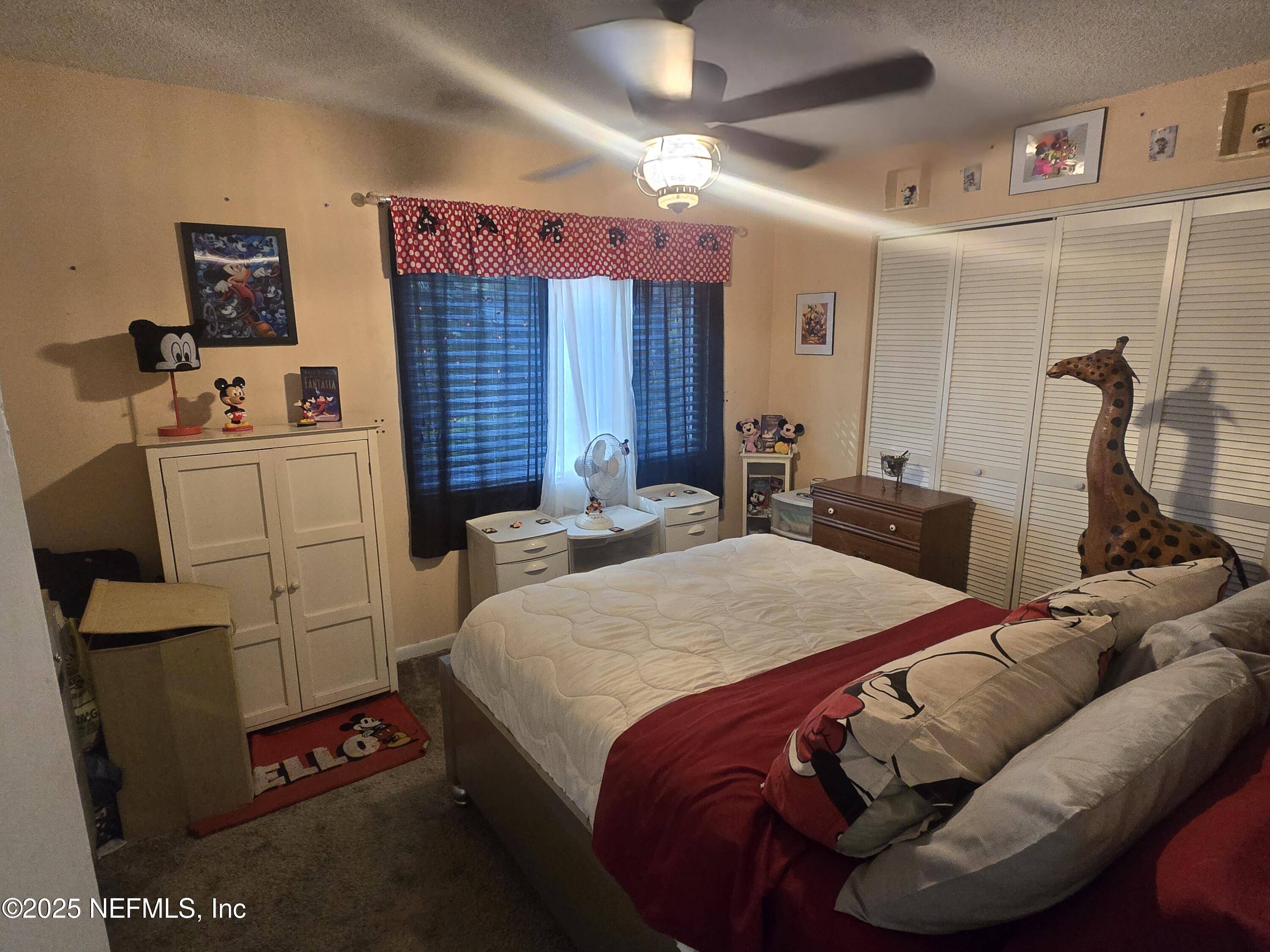 1259 The Grove Road Orange Park, FL 32073 - Photo 8 of 17 a bed room with a bed and a couch