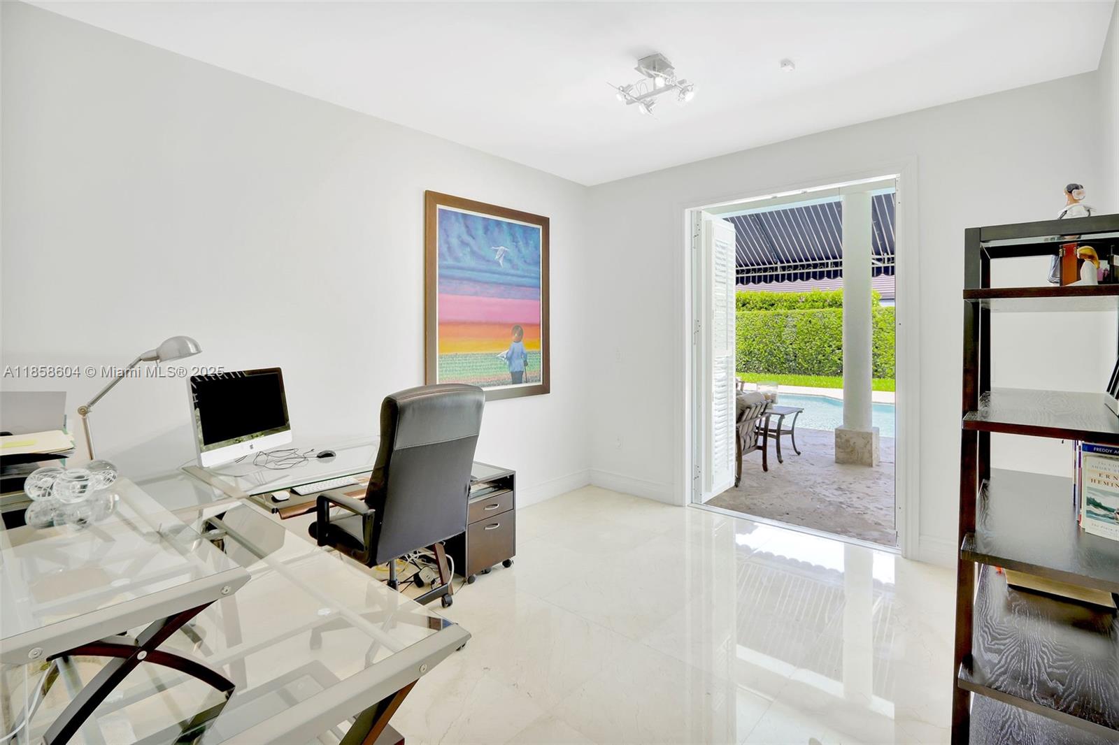 7261 Southwest 120th Avenue Miami, FL 33183 - Photo 26 of 50 a view of a workspace with furniture and a livingroom