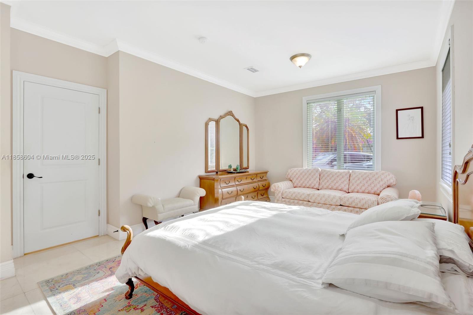 7261 Southwest 120th Avenue Miami, FL 33183 - Photo 31 of 50 a bedroom with a large bed and a window