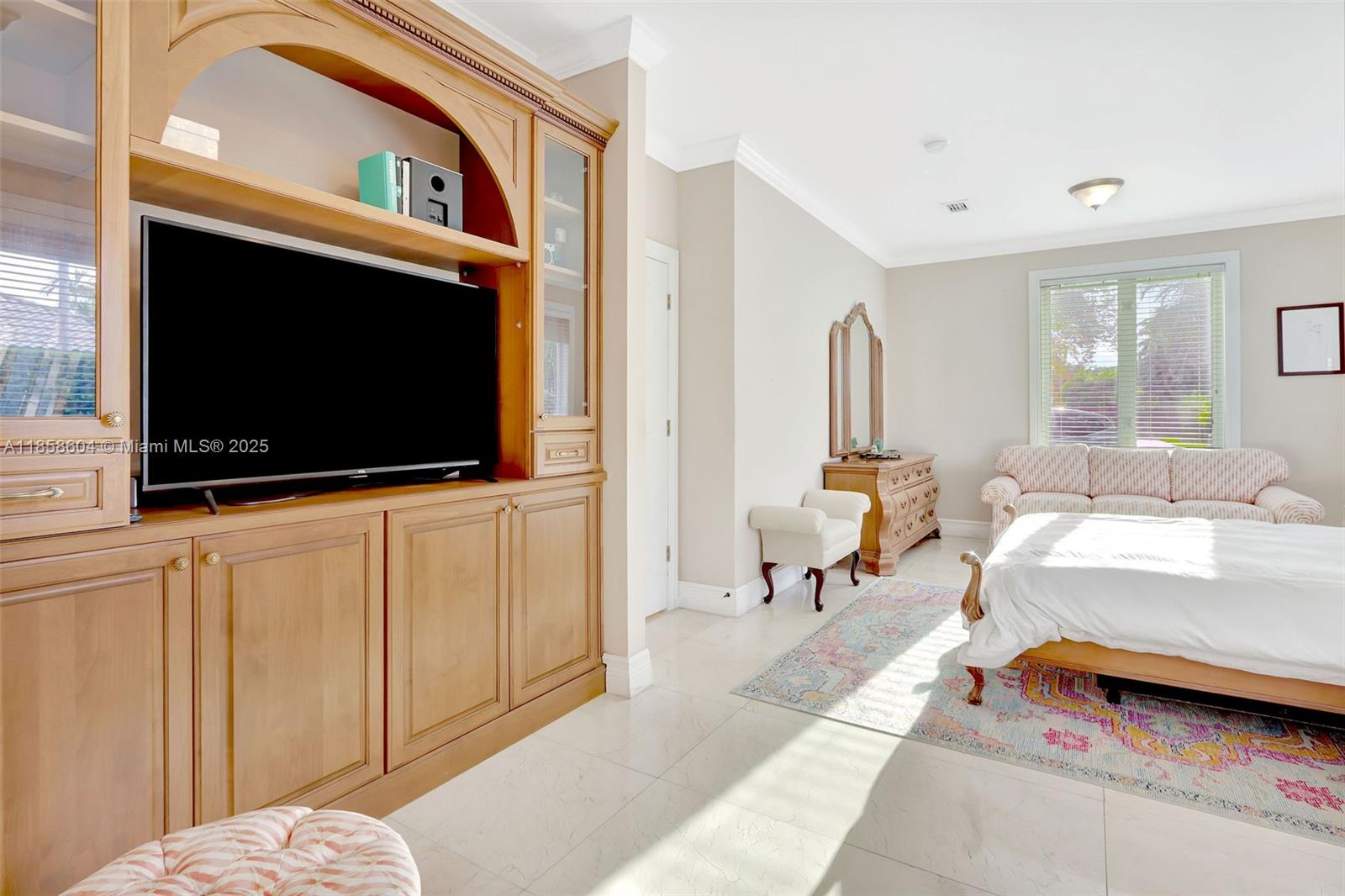 7261 Southwest 120th Avenue Miami, FL 33183 - Photo 32 of 50 a living room with furniture and a flat screen tv