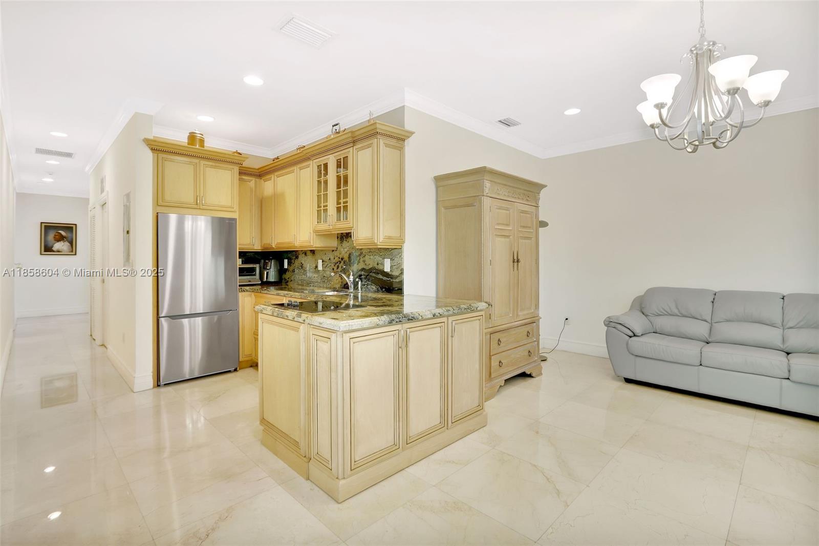 7261 Southwest 120th Avenue Miami, FL 33183 - Photo 36 of 50 a kitchen with stainless steel appliances a refrigerator sink and cabinets