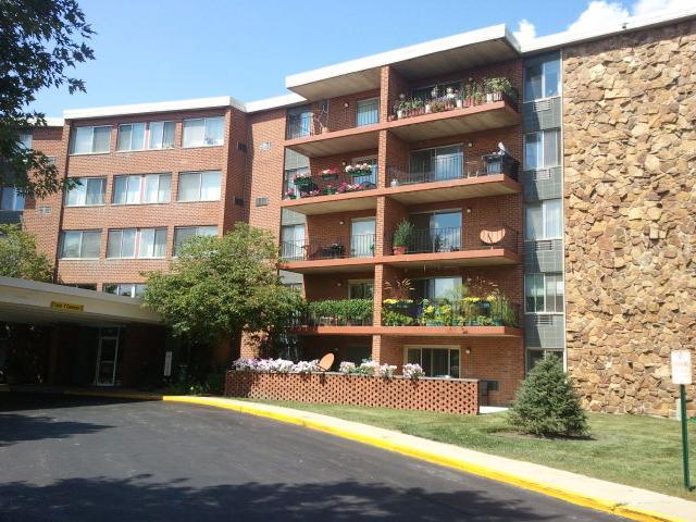 a front view of a building with garden