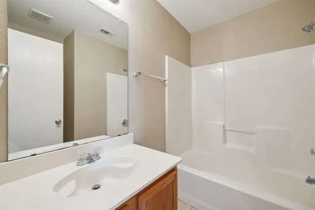 a bathroom with a sink and a bathtub