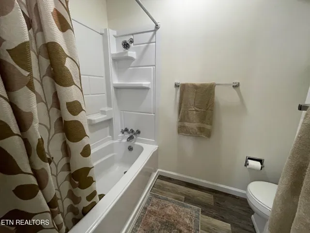 a bathroom with a bathtub and shower