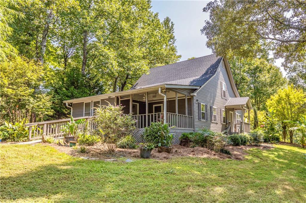 5010 Cagle Mill Road Lula, GA 30554 - Photo 1 of 1 a front view of a house with a yard