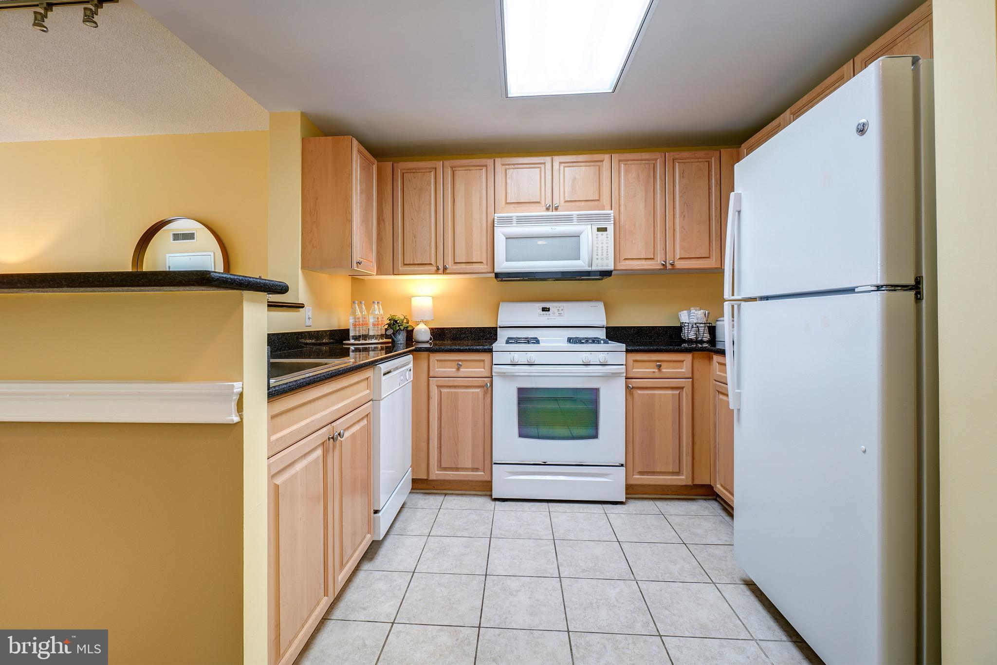 2726 Gallows Road, Unit 1302 Vienna, VA 22180 - Photo 21 of 55 Built-in microwave and gas cooking.