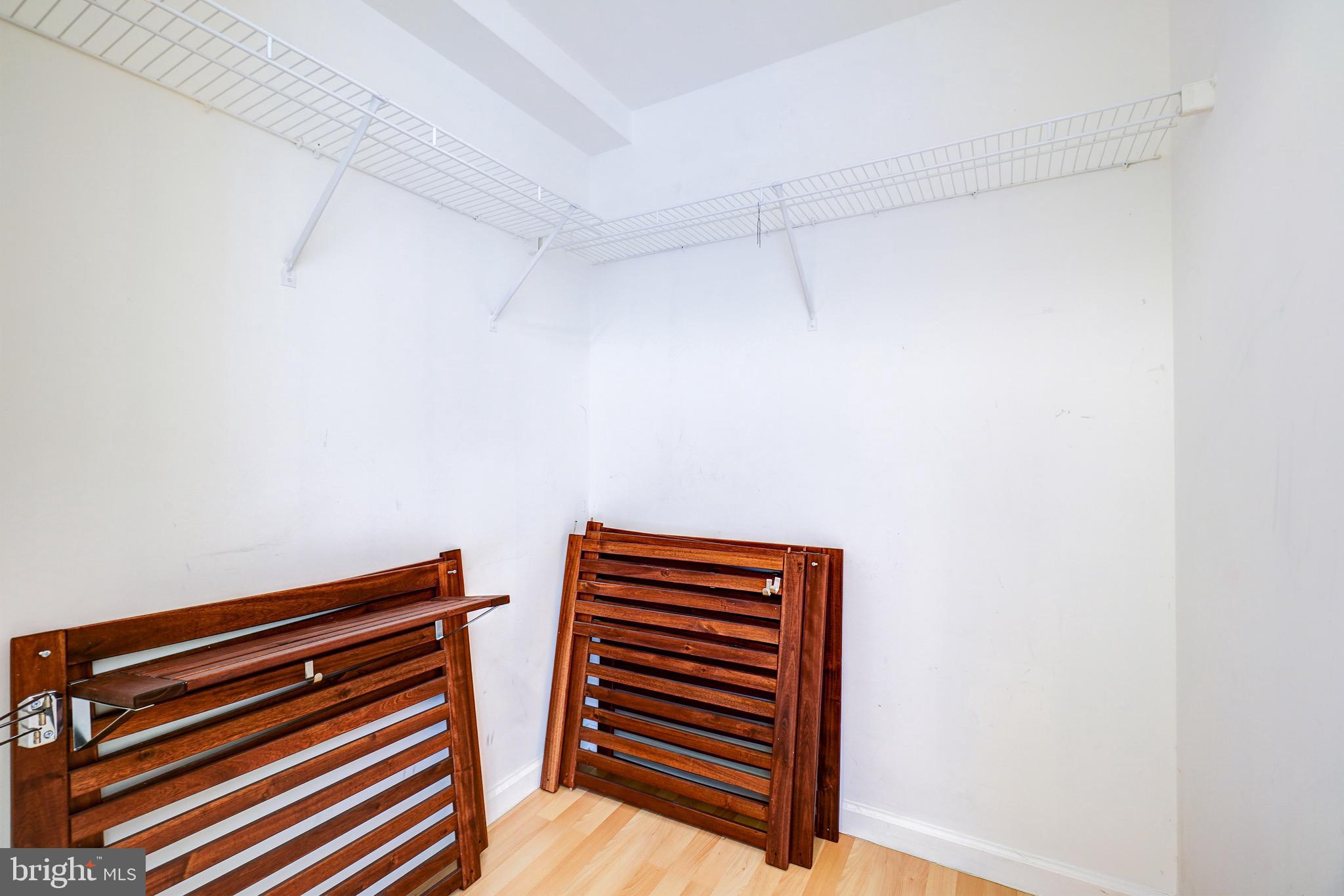 2726 Gallows Road, Unit 1302 Vienna, VA 22180 - Photo 25 of 55 Large walk-in closet with extra storage racks.