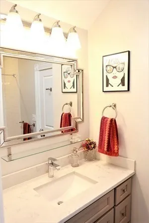 a bathroom with a sink and a mirror
