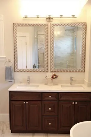 a bathroom with a double vanity sink and mirror