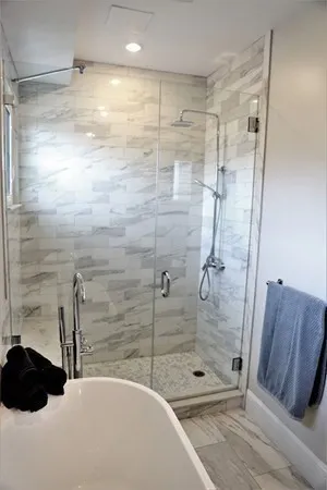 a bathroom with a shower and a sink
