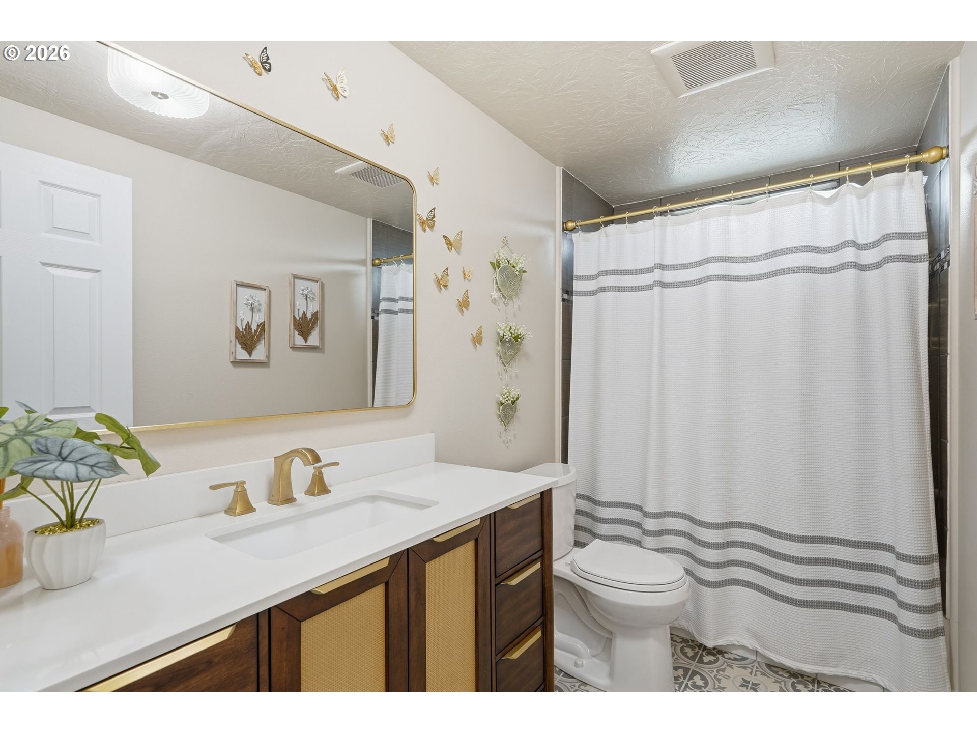 300 Southwest 7th Street, Unit 508 Battle Ground, WA 98604 - Photo 24 of 38 a bathroom with a sink a toilet and shower curtain
