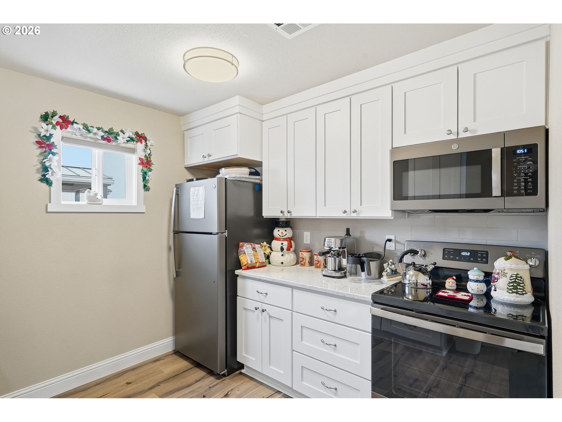300 Southwest 7th Street, Unit 508 Battle Ground, WA 98604 - Photo 33 of 38 a kitchen with stainless steel appliances granite countertop a refrigerator sink and microwave