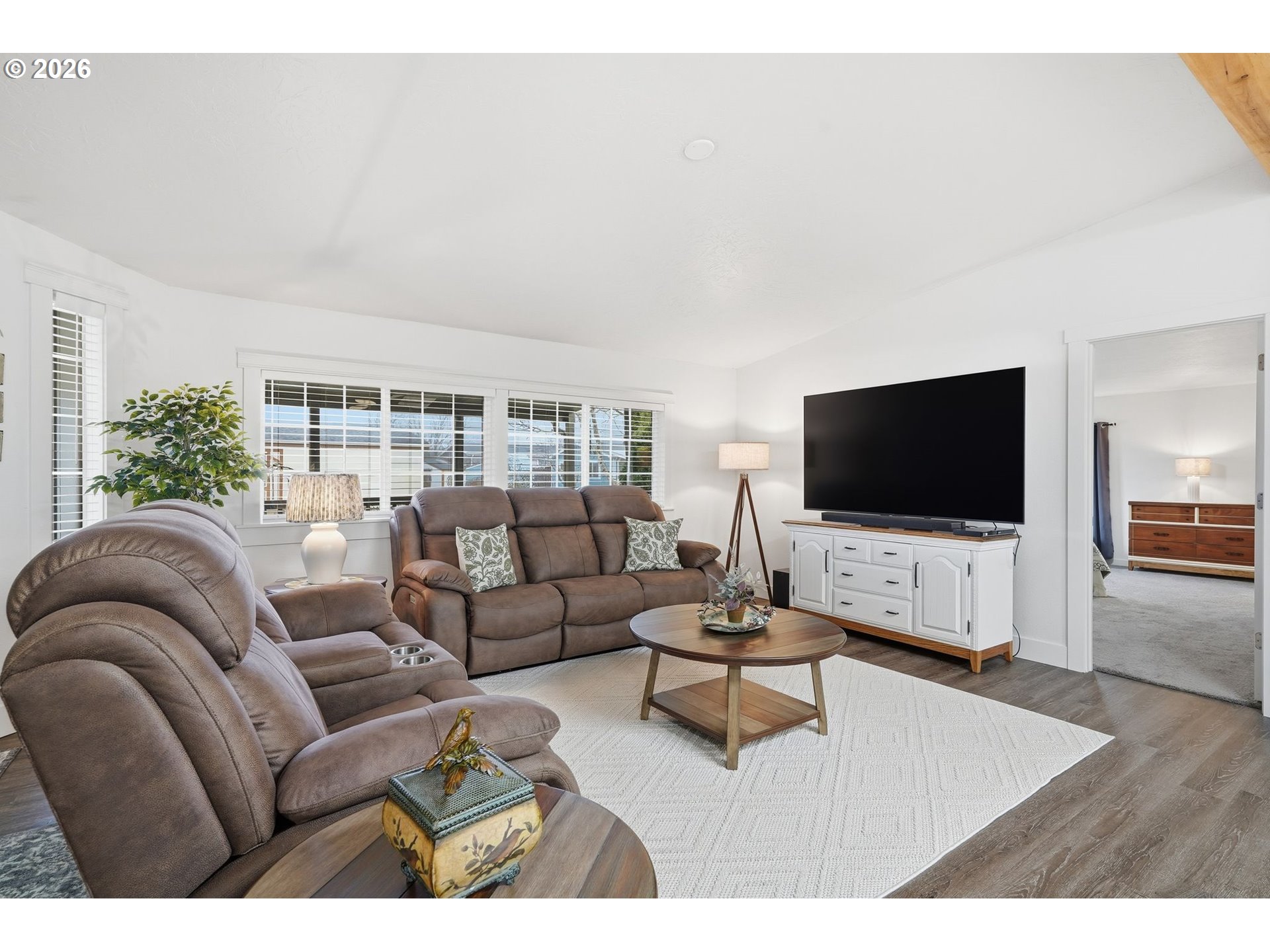 300 Southwest 7th Street, Unit 508 Battle Ground, WA 98604 - Photo 4 of 38 a living room with furniture and a flat screen tv