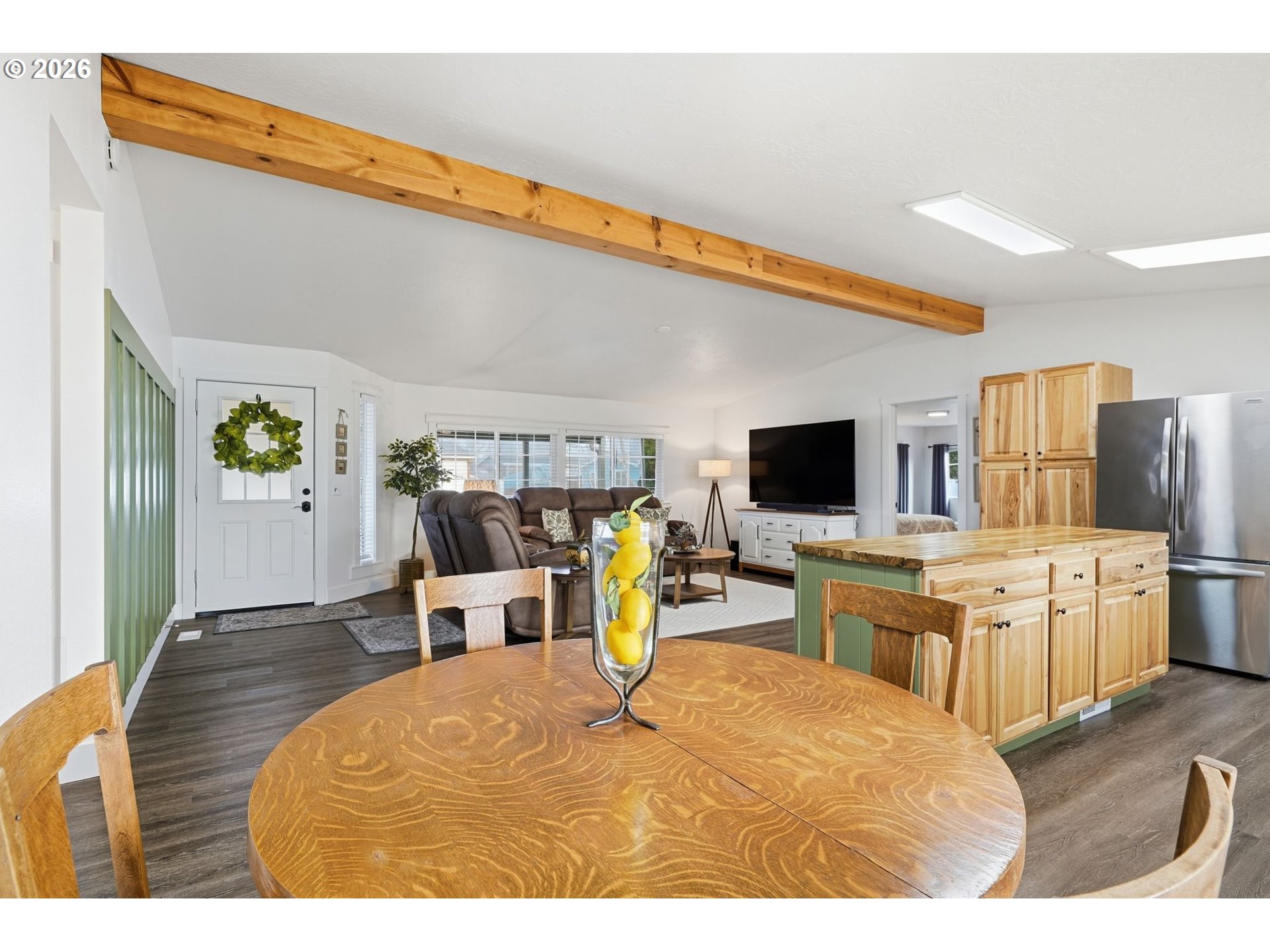 300 Southwest 7th Street, Unit 508 Battle Ground, WA 98604 - Photo 8 of 38 a living room with stainless steel appliances furniture a flat screen tv and kitchen view