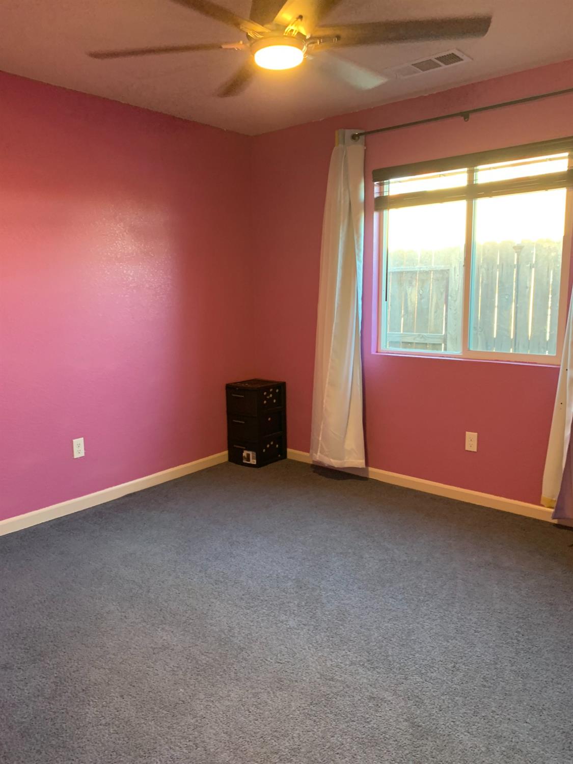 348 Silva Street Mendota, CA 93640 - Photo 15 of 24 an empty room with windows