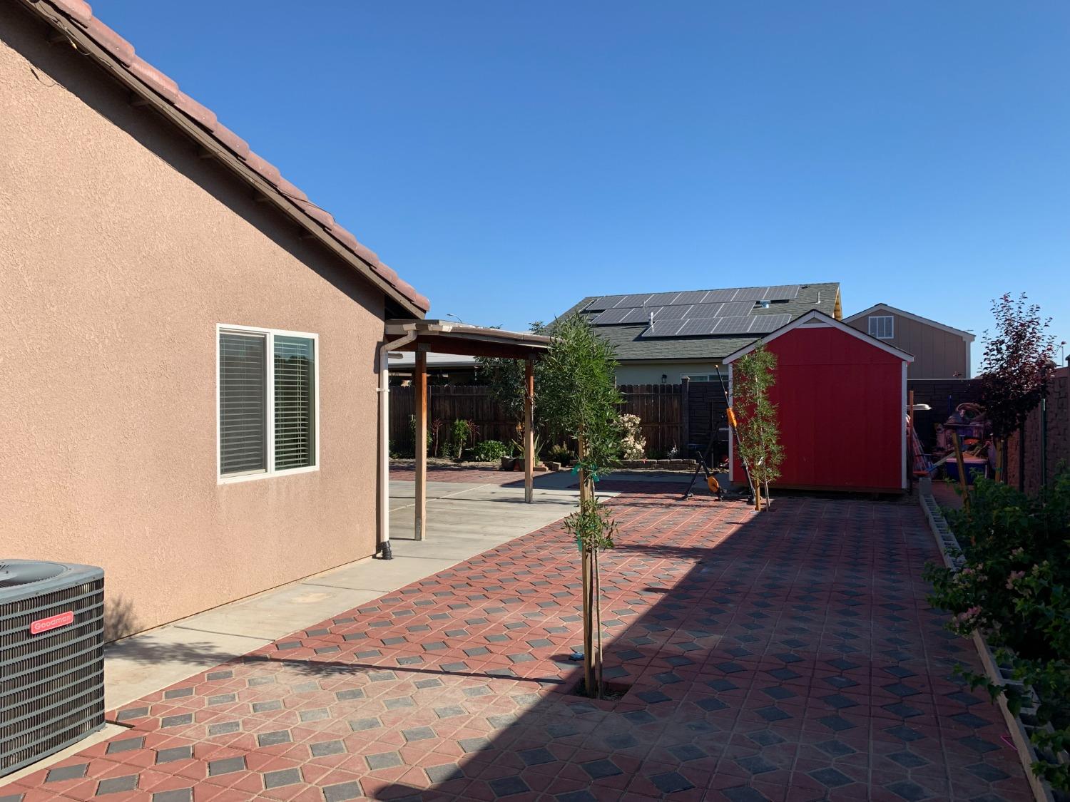 348 Silva Street Mendota, CA 93640 - Photo 22 of 24 a view of a house with backyard and porch