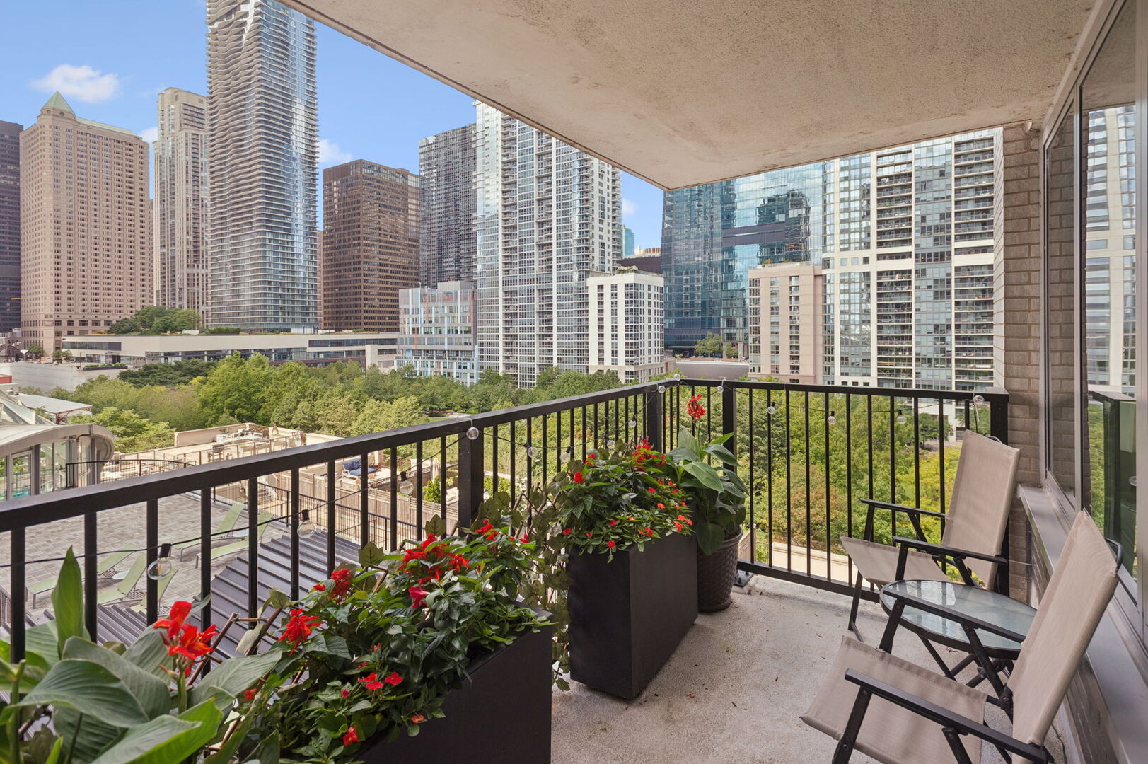 400 East Randolph Street, Unit 930 Chicago, IL 60601 - Photo 15 of 34 a view of a balcony with wooden chairs