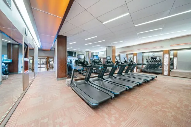 a view of a patio with table and chairs