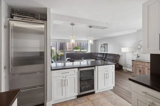a kitchen with a sink stove and refrigerator