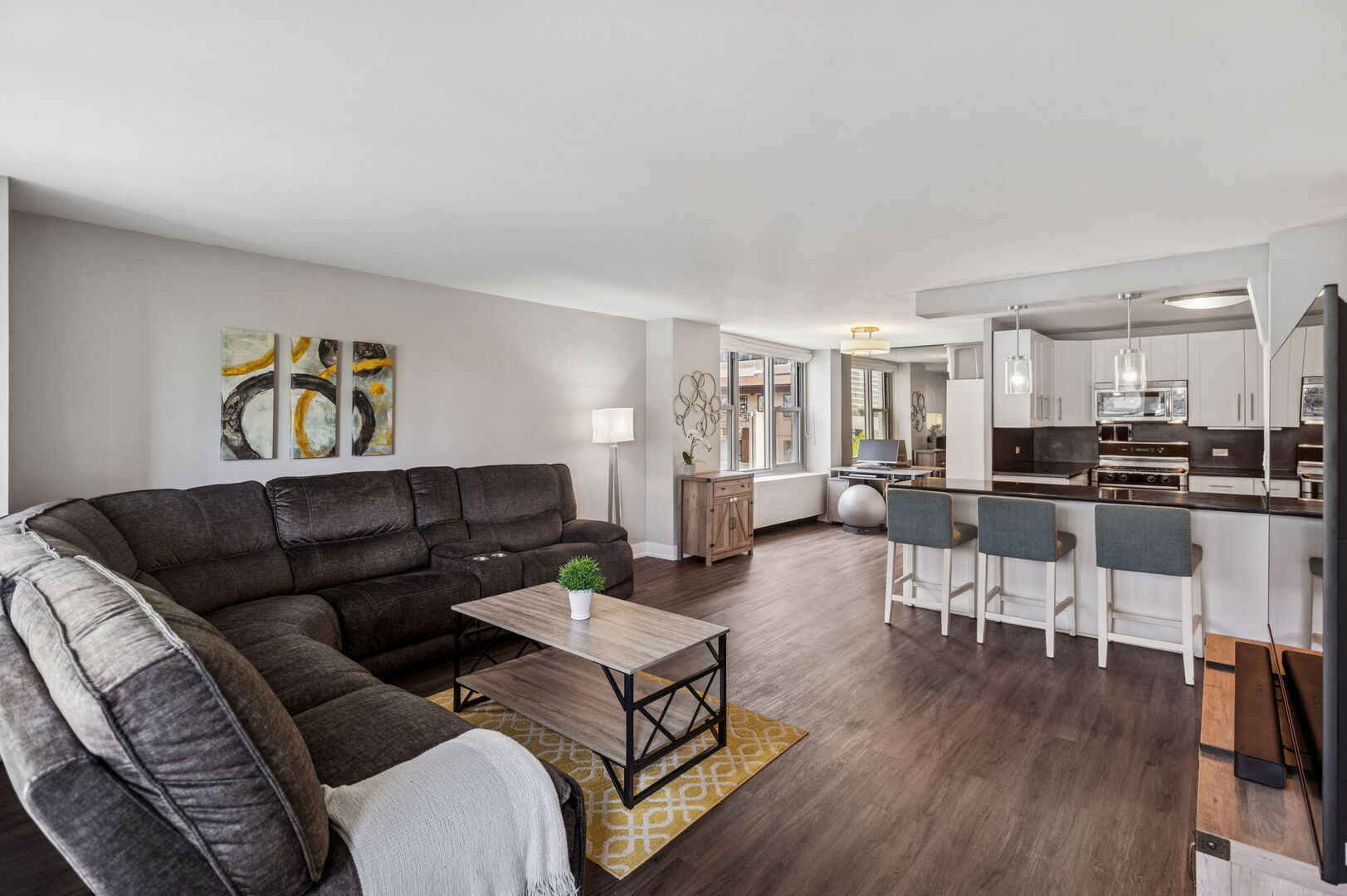 400 East Randolph Street, Unit 930 Chicago, IL 60601 - Photo 10 of 34 a living room with furniture and kitchen view