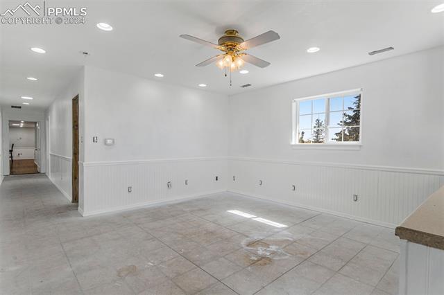 1150 Slocum Road Colorado Springs, CO 80930 - Photo 17 of 30 Tiled empty room with ceiling fan