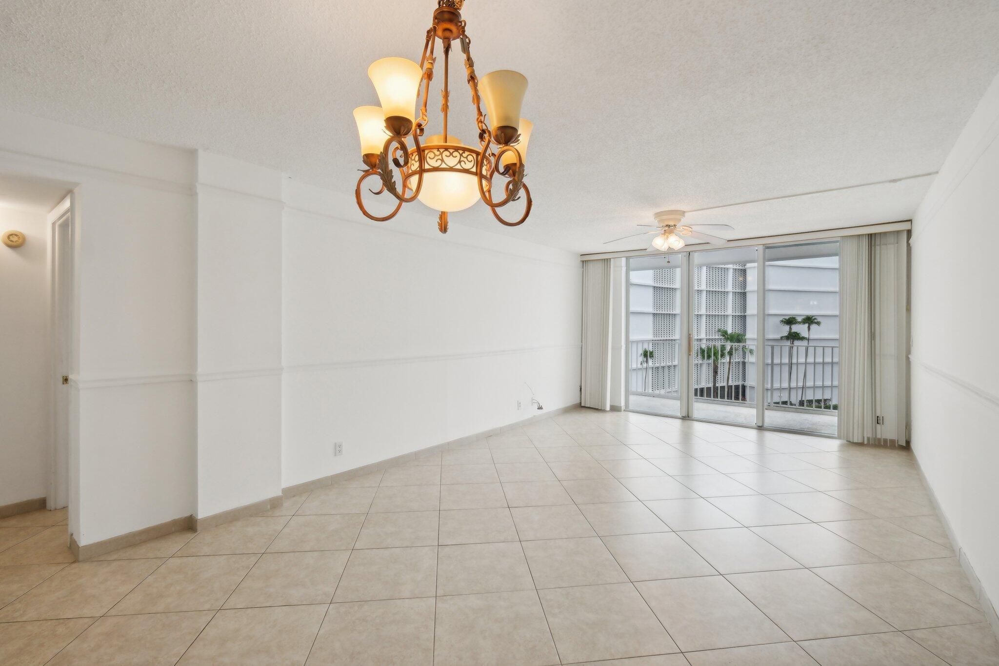 3580 South Ocean Boulevard, Unit 4C South Palm Beach, FL 33480 - Photo 12 of 36 a view of an empty room with a window