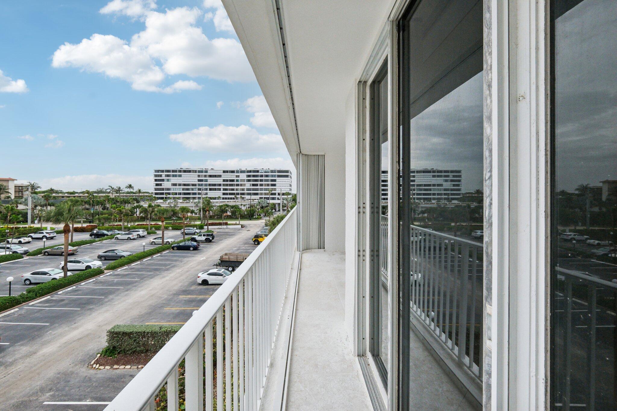3580 South Ocean Boulevard, Unit 4C South Palm Beach, FL 33480 - Photo 23 of 36 a city view from a balcony