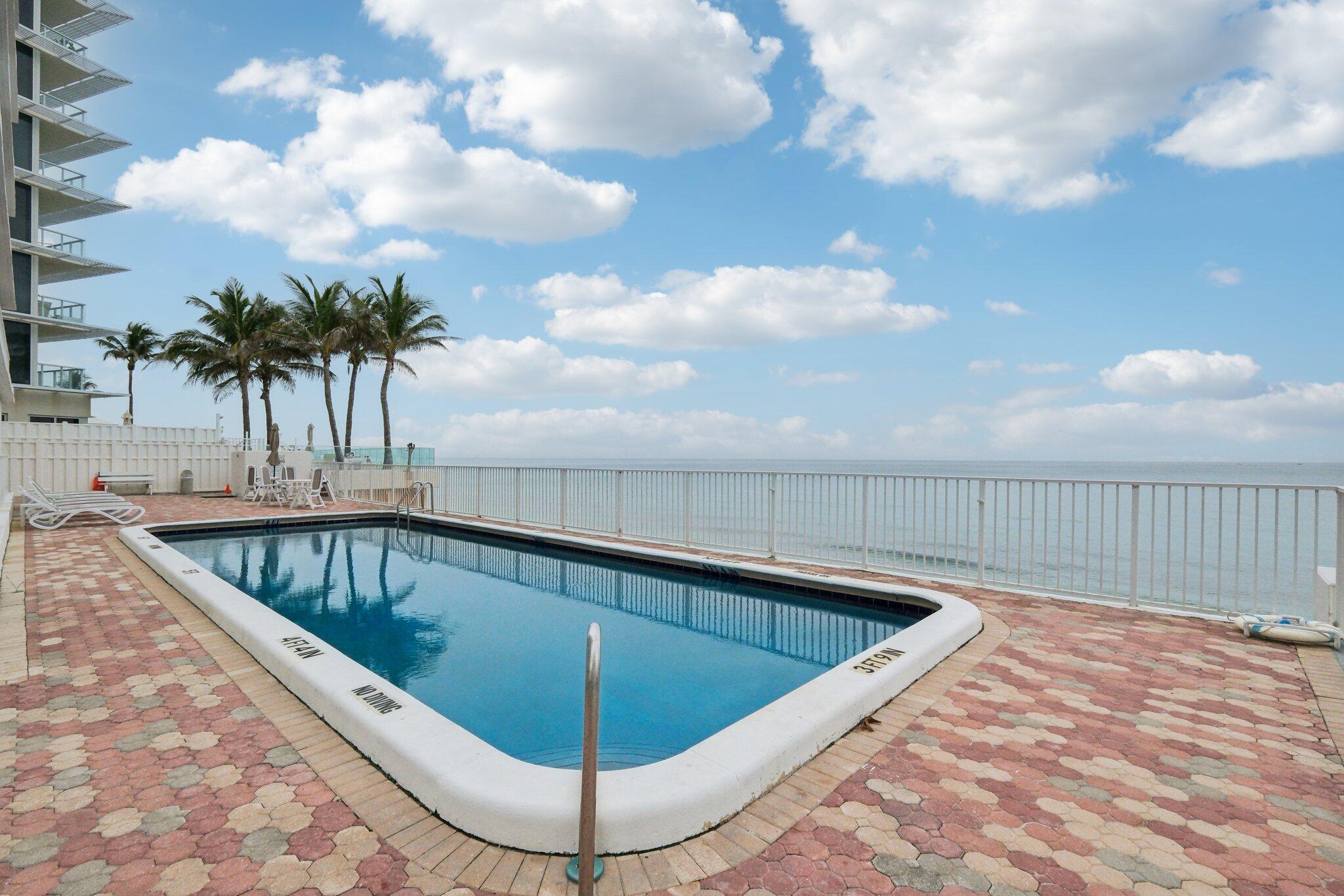 3580 South Ocean Boulevard, Unit 4C South Palm Beach, FL 33480 - Photo 25 of 36 a view of swimming pool having outdoor seating