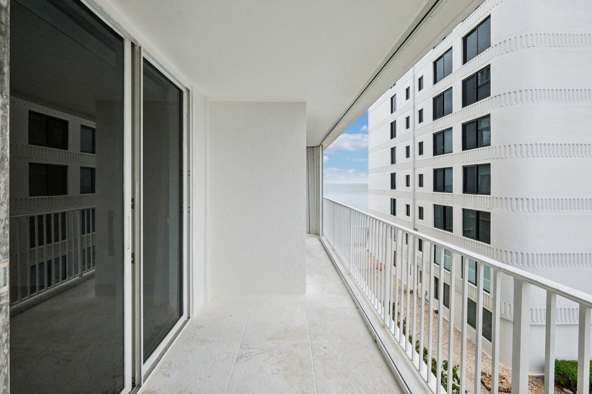 3580 South Ocean Boulevard, Unit 4C South Palm Beach, FL 33480 - Photo 3 of 36 a view of staircase with white walls