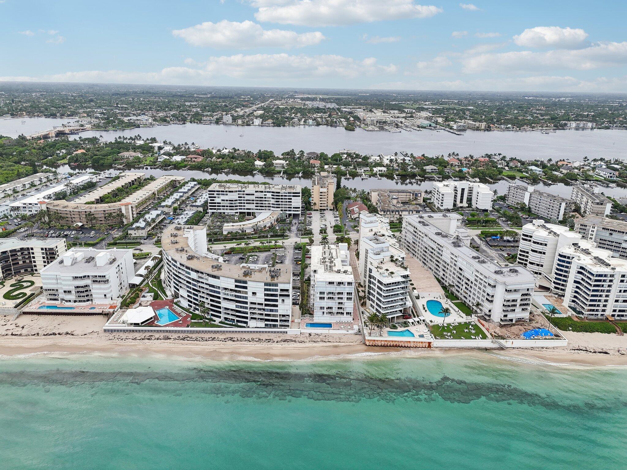 3580 South Ocean Boulevard, Unit 4C South Palm Beach, FL 33480 - Photo 31 of 36 an aerial view of residential building with yard and ocean view