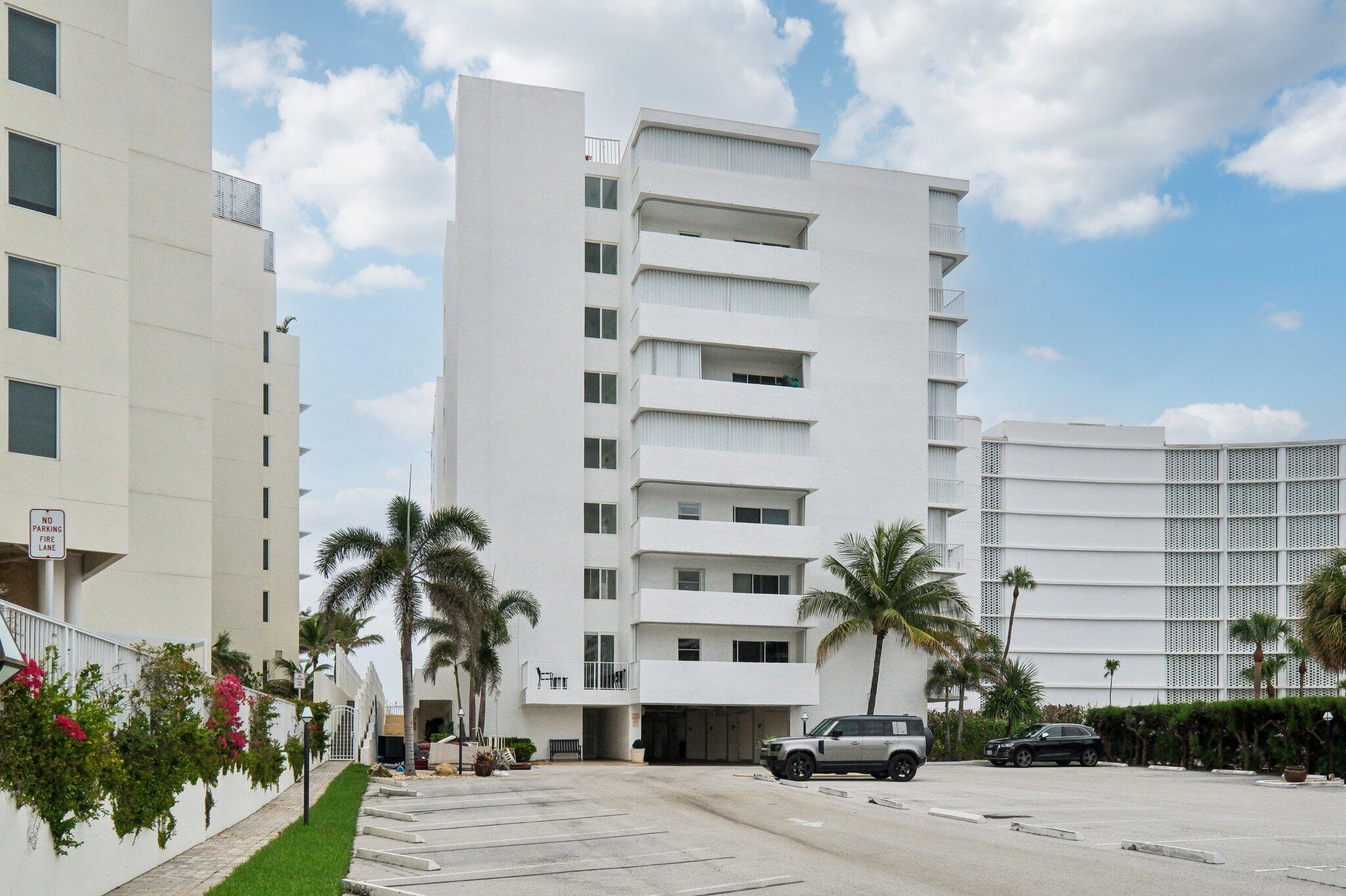 3580 South Ocean Boulevard, Unit 4C South Palm Beach, FL 33480 - Photo 33 of 36 a front view of a multi story building