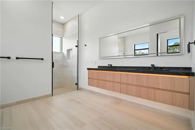 a bathroom with a sink and a mirror