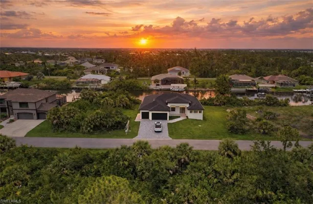 an aerial view of a house with a yard