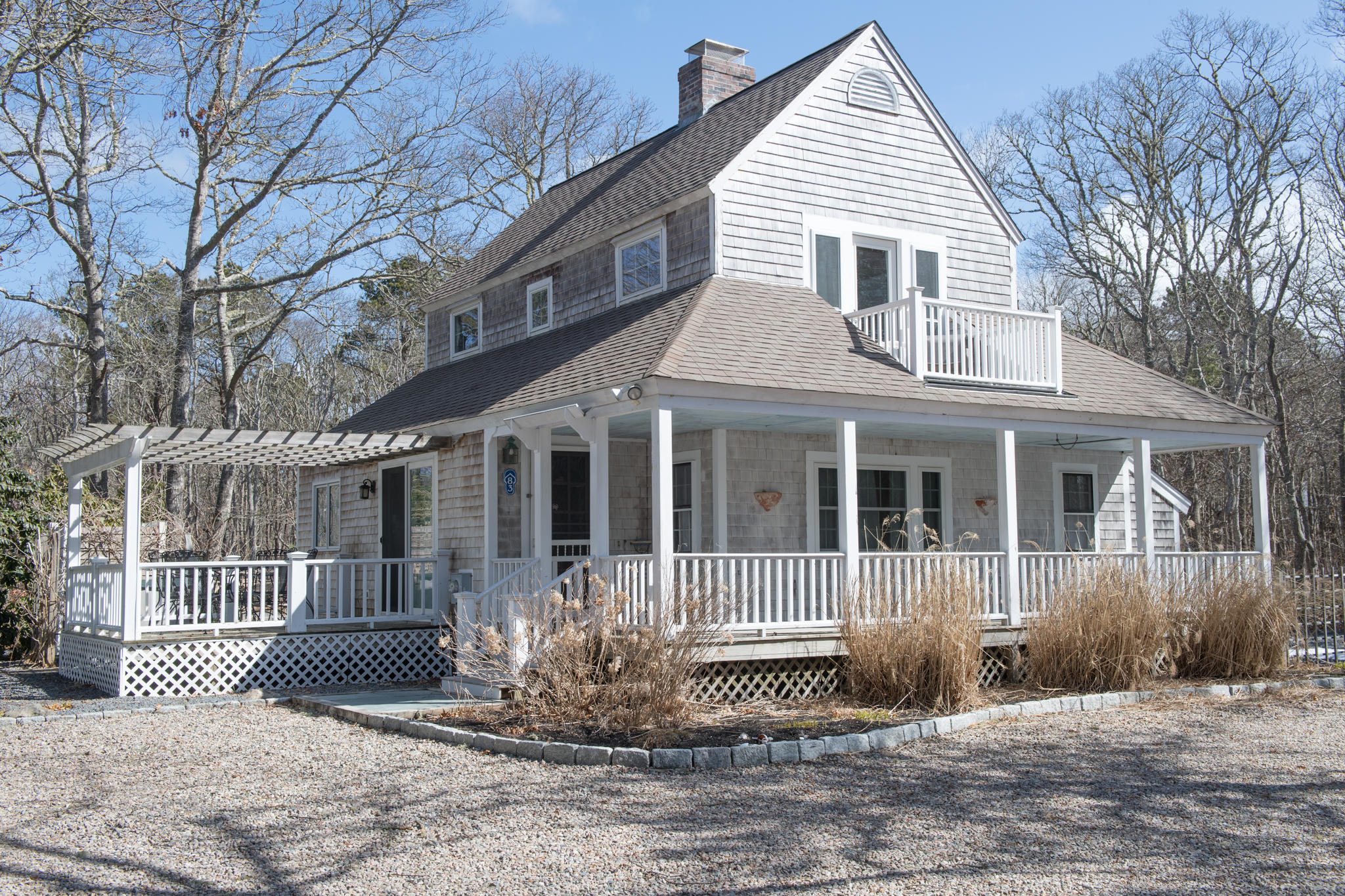 83 Neshobe Road Mashpee, MA 02649 - Photo 1 of 31 a front view of a house with a yard
