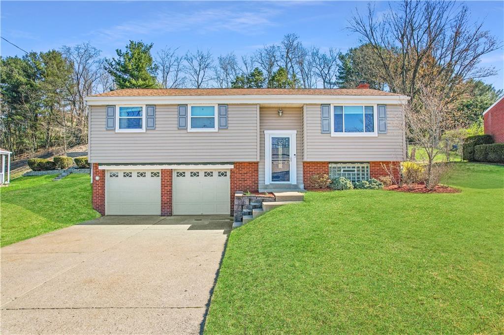 2027 Cutter Drive McKees Rocks, PA 15136 - Photo 1 of 22 a front view of house with yard and green space