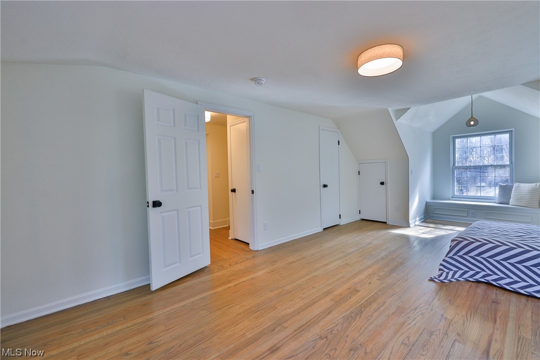 32887 Cedar Road Mayfield Heights, OH 44124 - Photo 13 of 44 Bonus room featuring light hardwood / wood-style flooring and vaulted ceiling