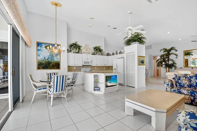 a kitchen with granite countertop a sink and a stove top oven