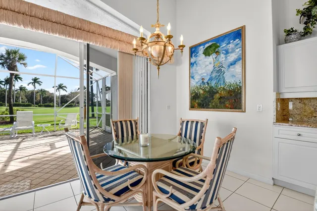 a kitchen with granite countertop white cabinets and a sink