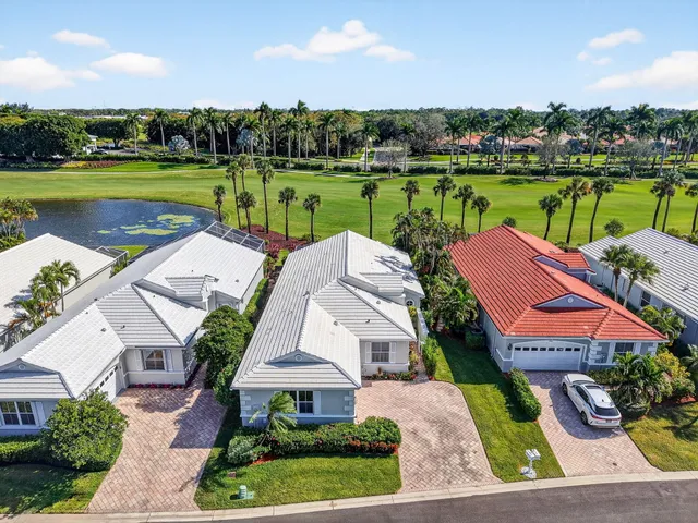 an aerial view of house with yard swimming pool and outdoor seating