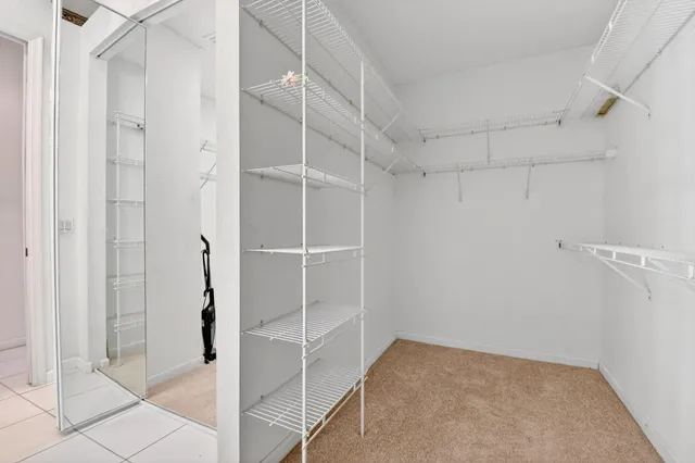 a bathroom with a toilet and a shower curtain