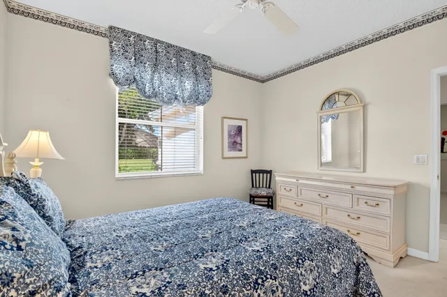a view of a chairs and table in backyard of the house