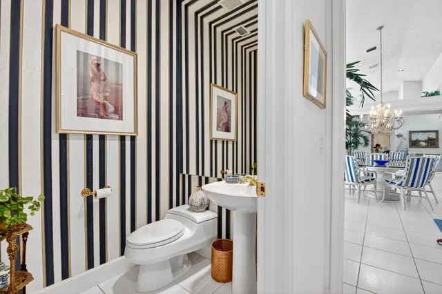 an aerial view of residential houses with outdoor space and swimming pool