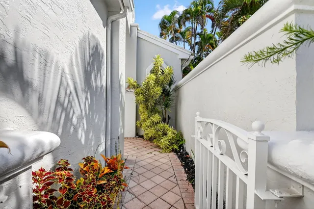 a vase of flowers sitting on a floor
